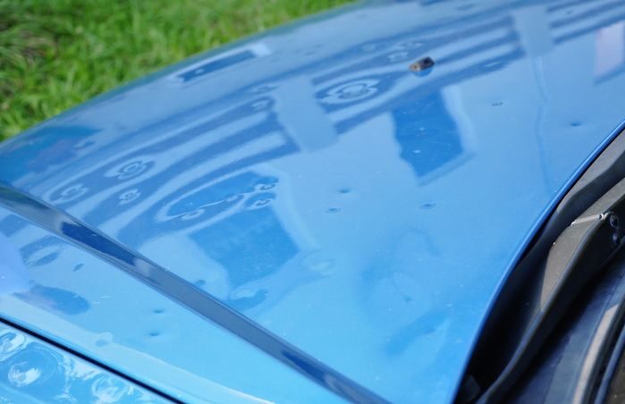 hail damage on hood of car